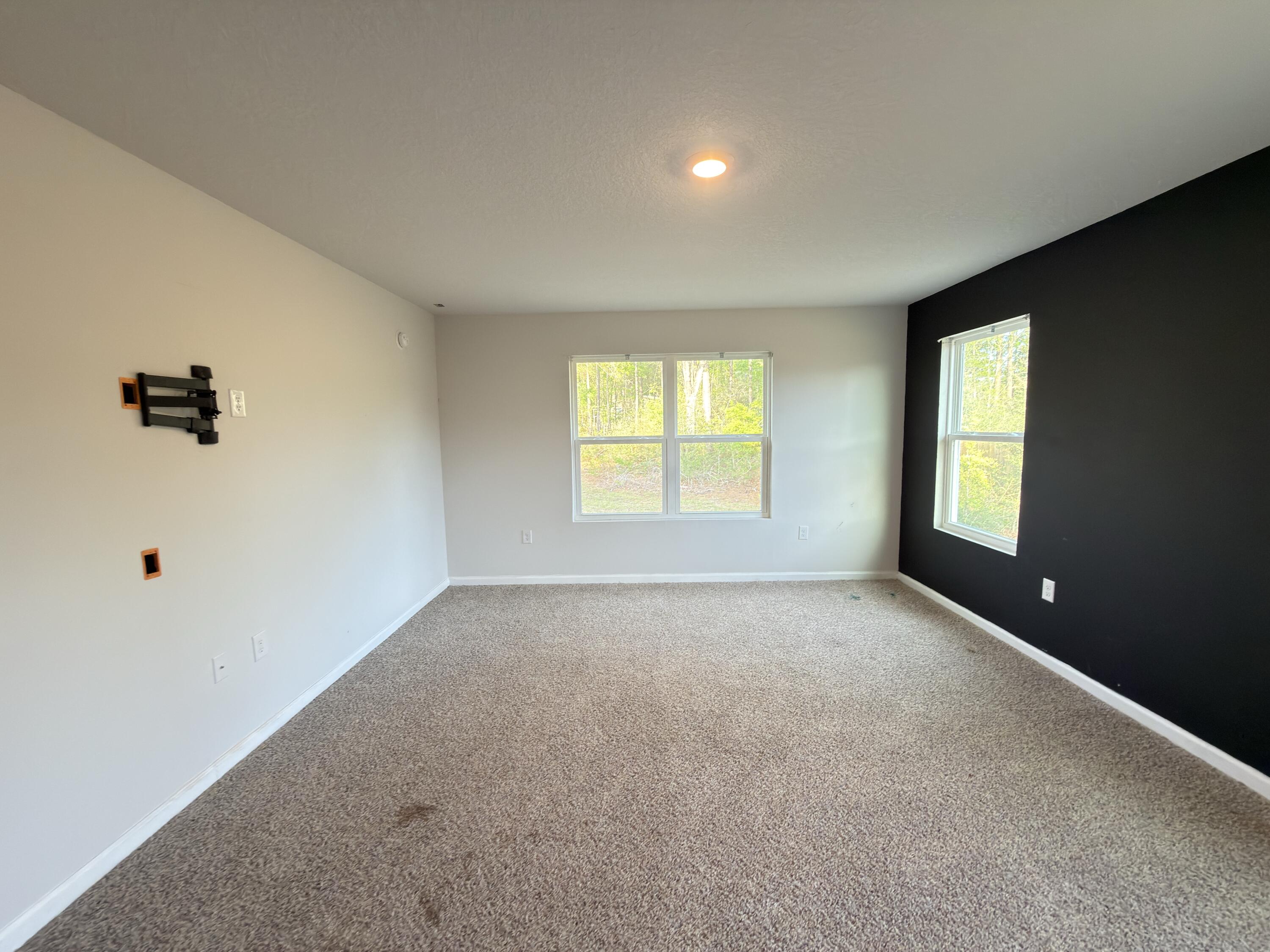 3545 Sugar Maple Lane Crestview, FL 32539 - Photo 9 of 27 an empty room with windows