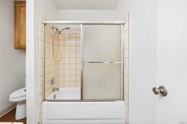 a bathroom with a shower and a toilet