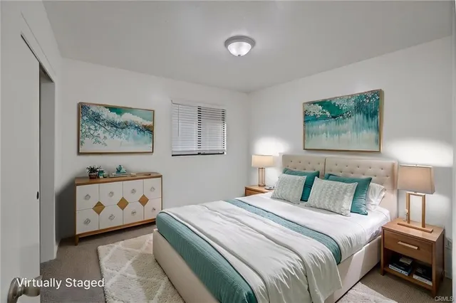 a bedroom with a bed and a baby crib