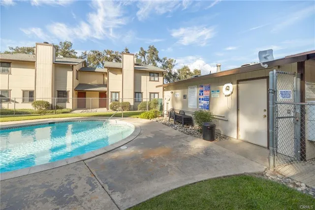 a view of swimming pool with outdoor seating
