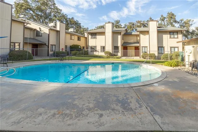 a view of a swimming pool in front of a building