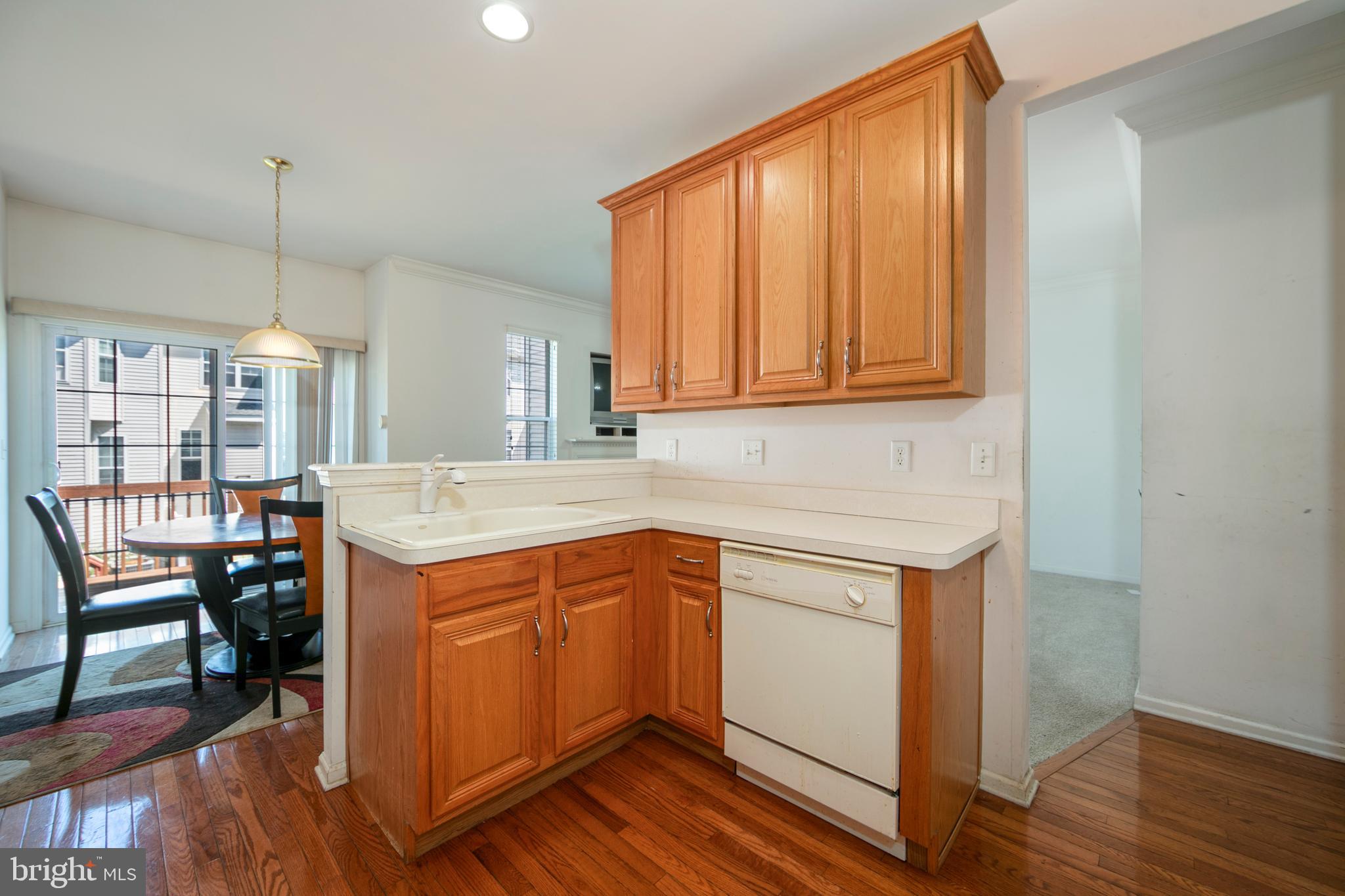 342 Huntington Drive Delran, NJ 08075 - Photo 14 of 45 a kitchen with a sink cabinets and wooden floor
