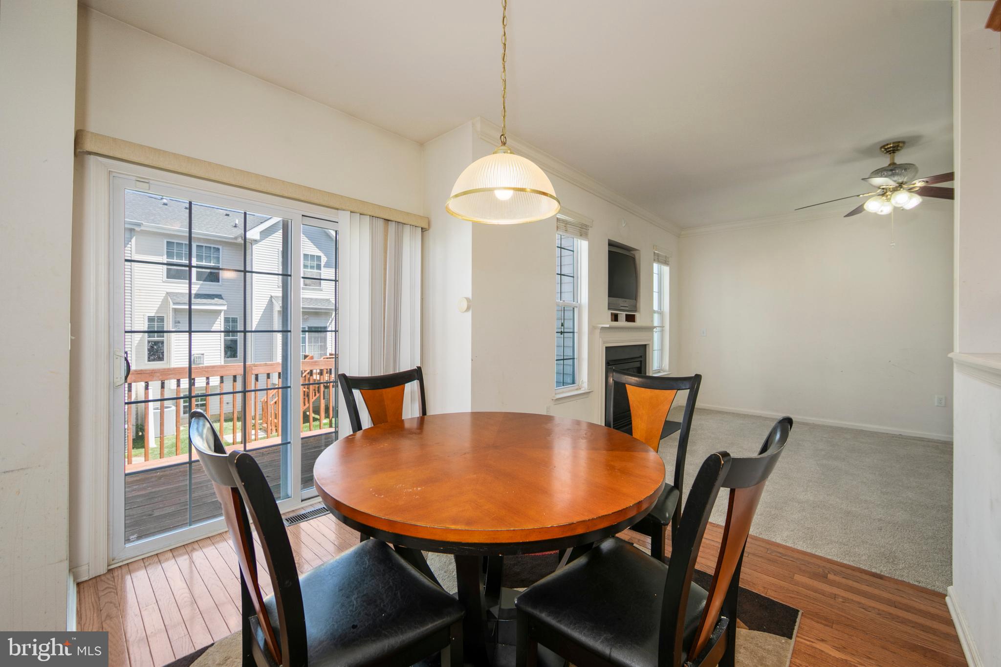 342 Huntington Drive Delran, NJ 08075 - Photo 15 of 45 a view of a dining room with furniture window and wooden floor