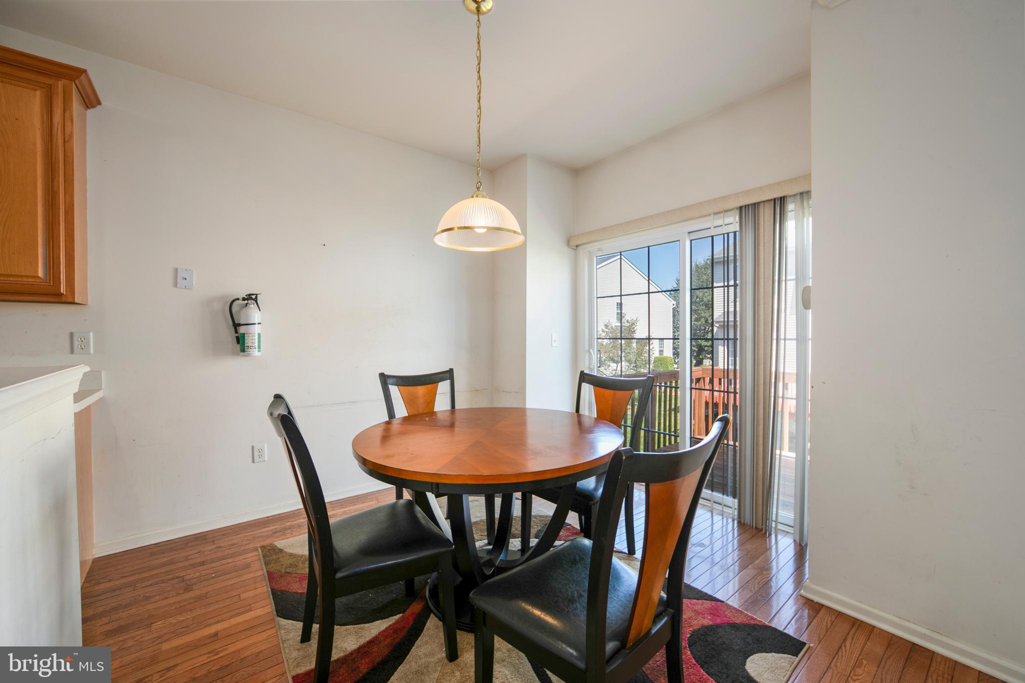 342 Huntington Drive Delran, NJ 08075 - Photo 17 of 45 a view of a dining room with furniture window and wooden floor