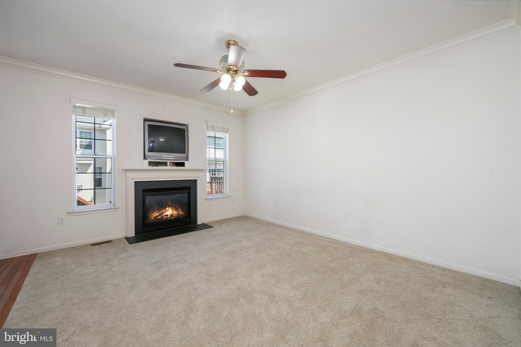 342 Huntington Drive Delran, NJ 08075 - Photo 18 of 45 a view of an empty room with a fireplace and a window