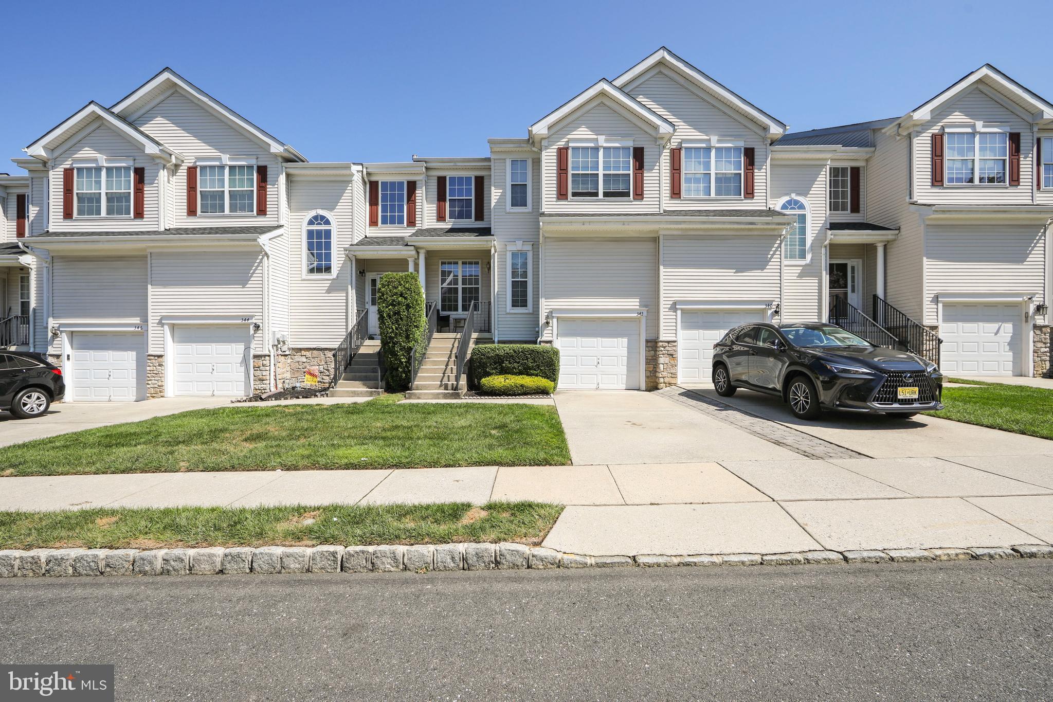 342 Huntington Drive Delran, NJ 08075 - Photo 2 of 45 a front view of a house with a yard and a garage