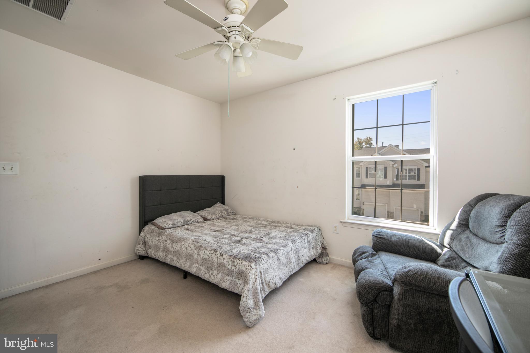 342 Huntington Drive Delran, NJ 08075 - Photo 28 of 45 a bedroom with a bed couch and window