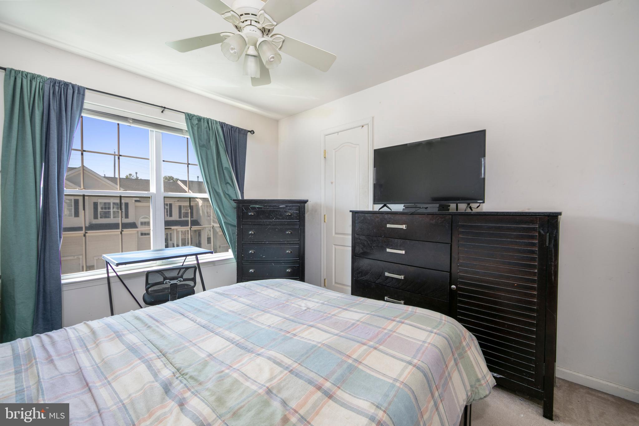 342 Huntington Drive Delran, NJ 08075 - Photo 31 of 45 a bedroom with a bed and a flat screen tv