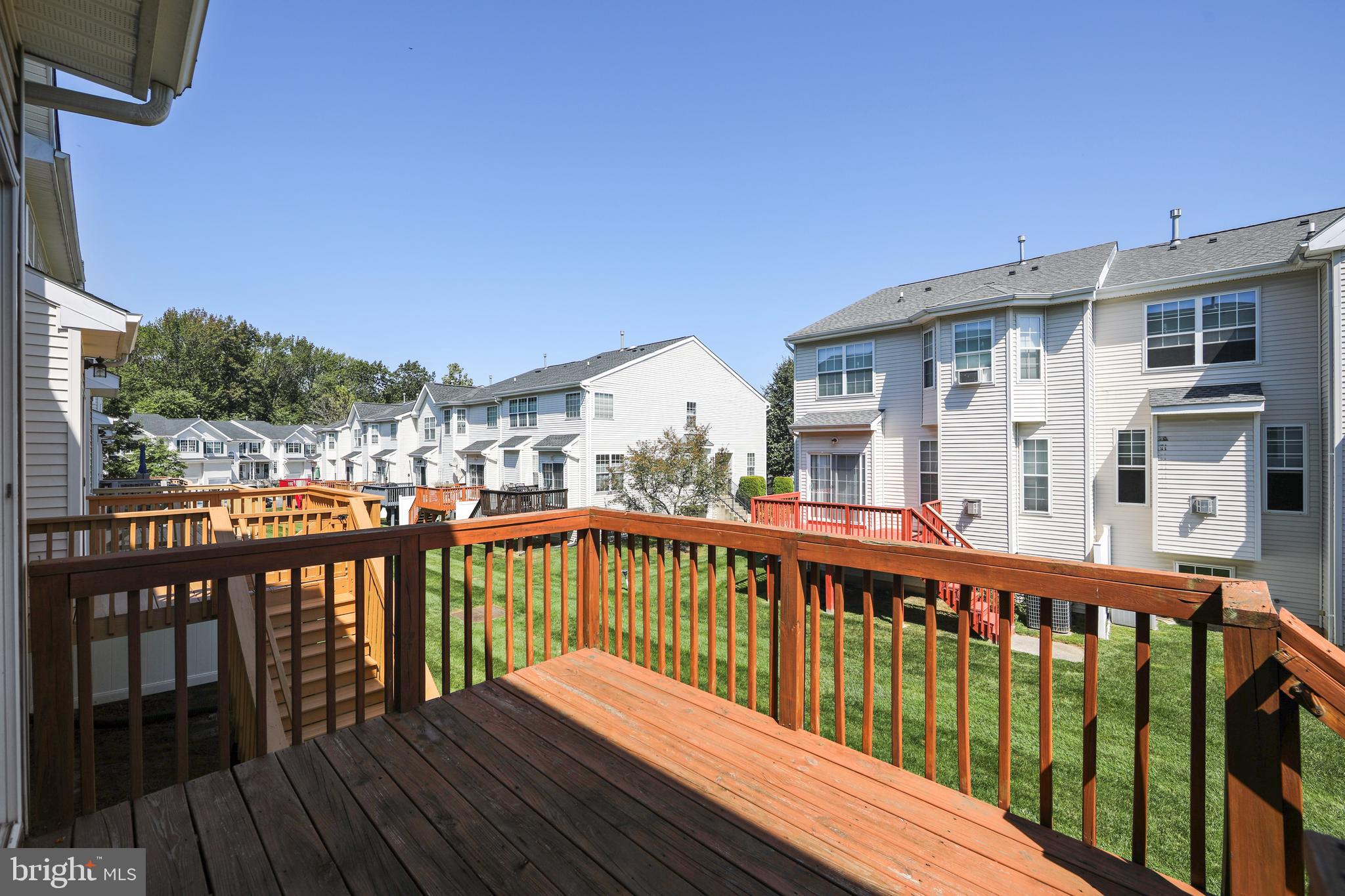 342 Huntington Drive Delran, NJ 08075 - Photo 42 of 45 a view of a wooden deck with a large swimming pool