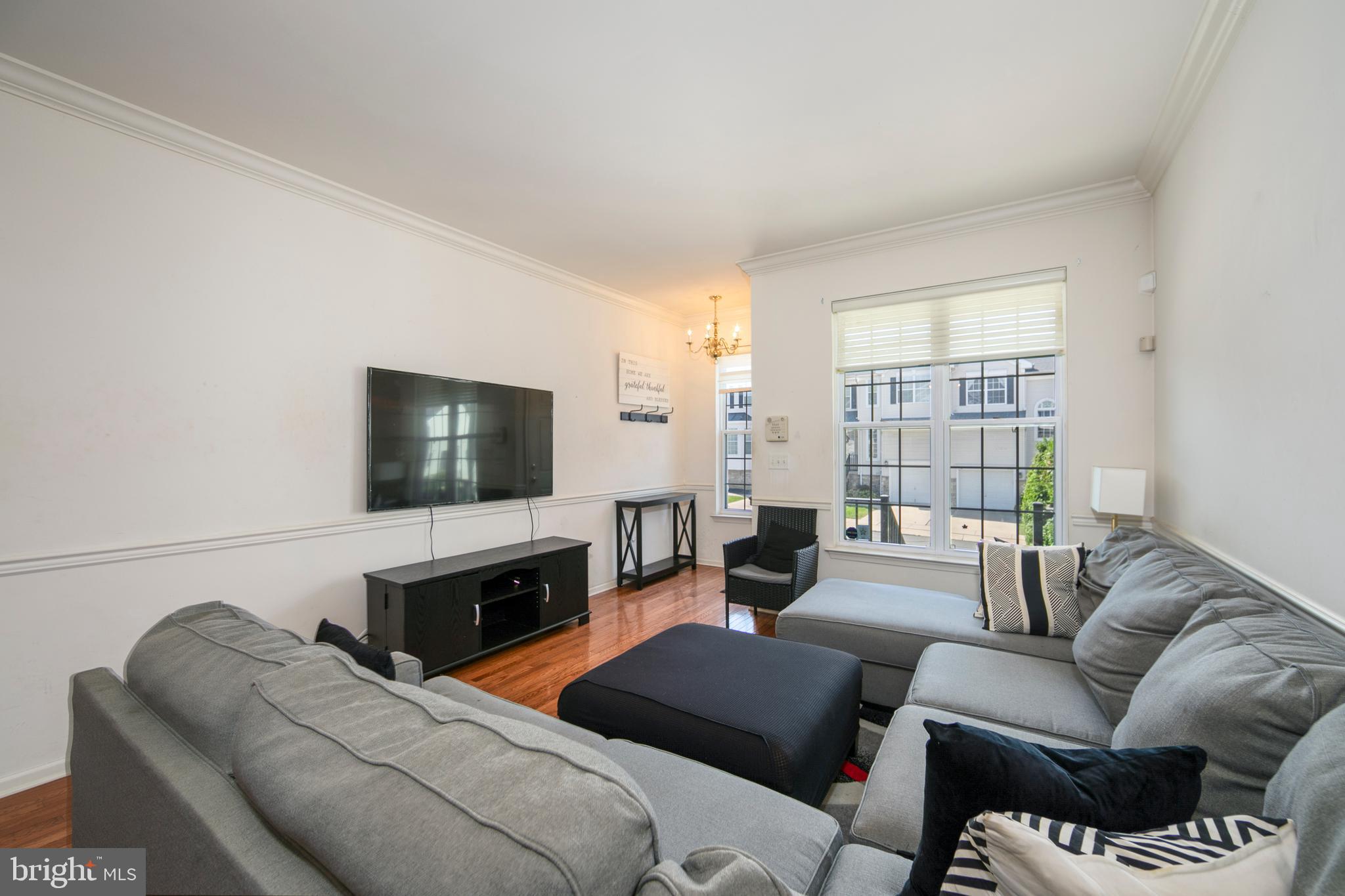 342 Huntington Drive Delran, NJ 08075 - Photo 8 of 45 a living room with furniture a flat screen tv and a fireplace