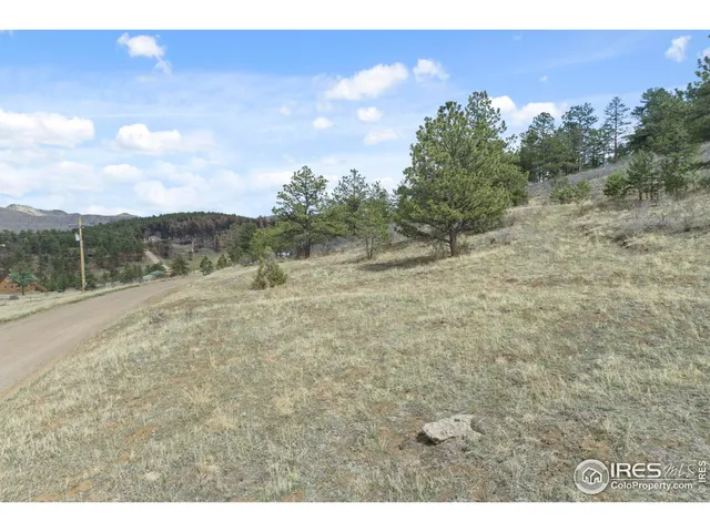 a view of a town with mountains in the background