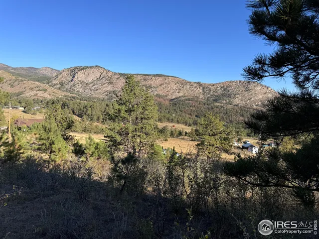 a view of mountains and valleys