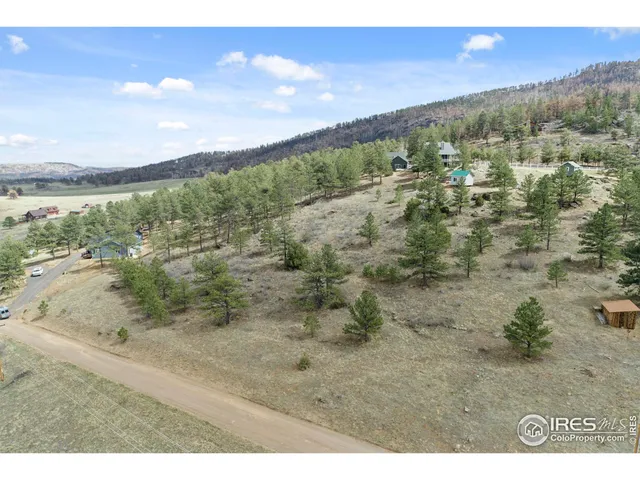 a view of a beach in front of a house