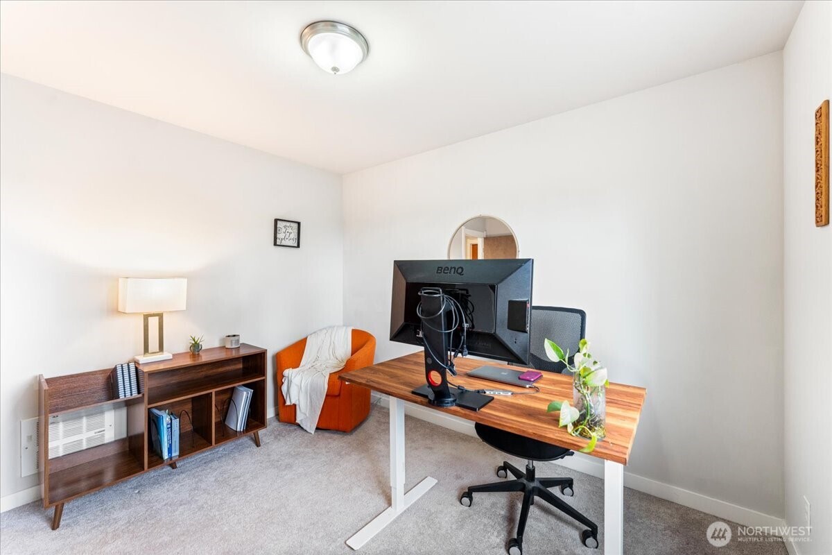 12418 2nd Place Southwest Burien, WA 98146 - Photo 24 of 39 a room with furniture and a wooden floor