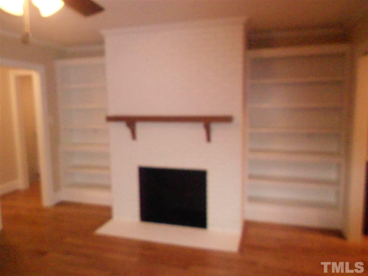 1208 Bancroft Street Raleigh, NC 27612 - Photo 11 of 22 a room with a fireplace