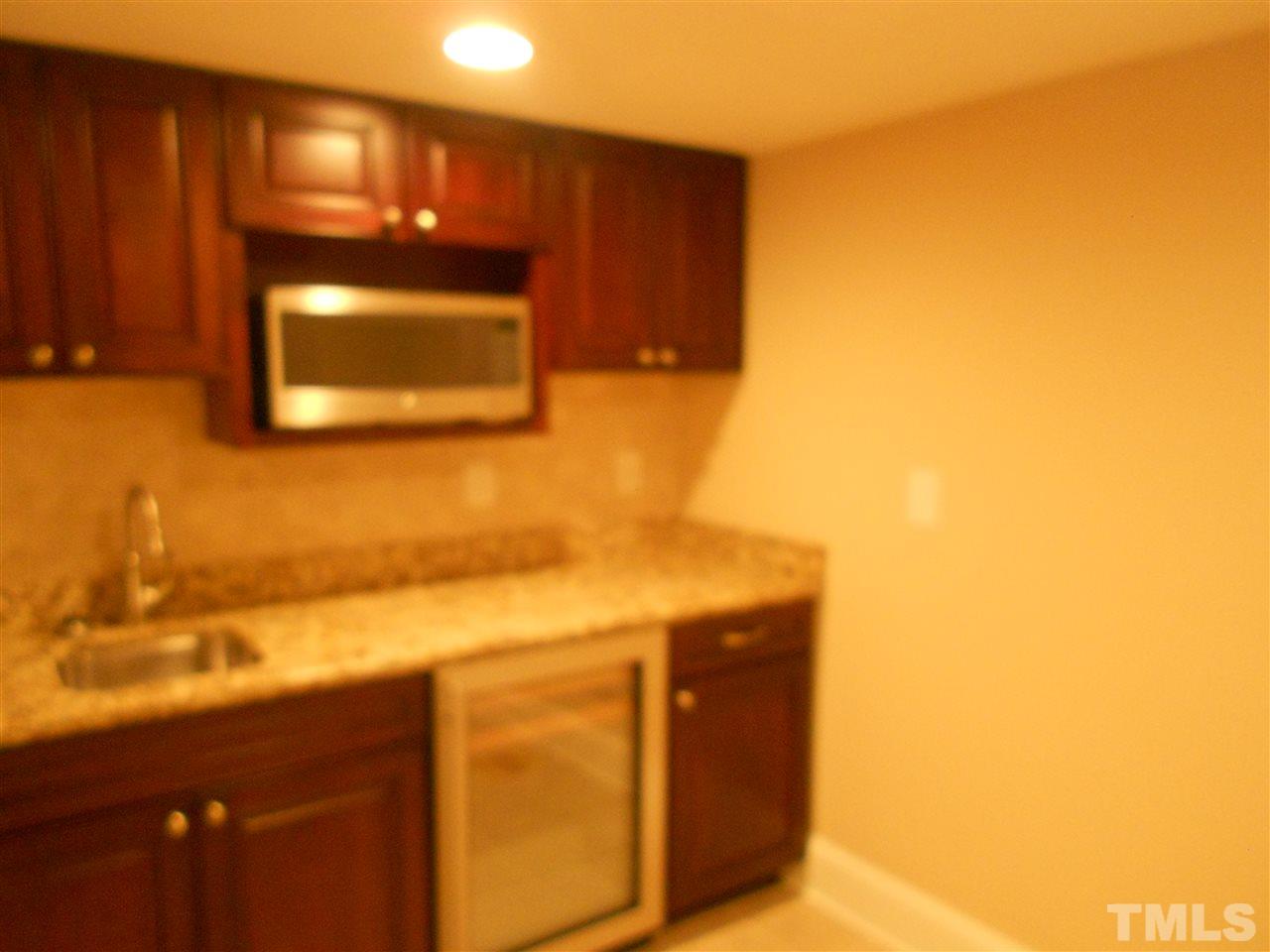 1208 Bancroft Street Raleigh, NC 27612 - Photo 21 of 22 a bathroom with a sink and a mirror