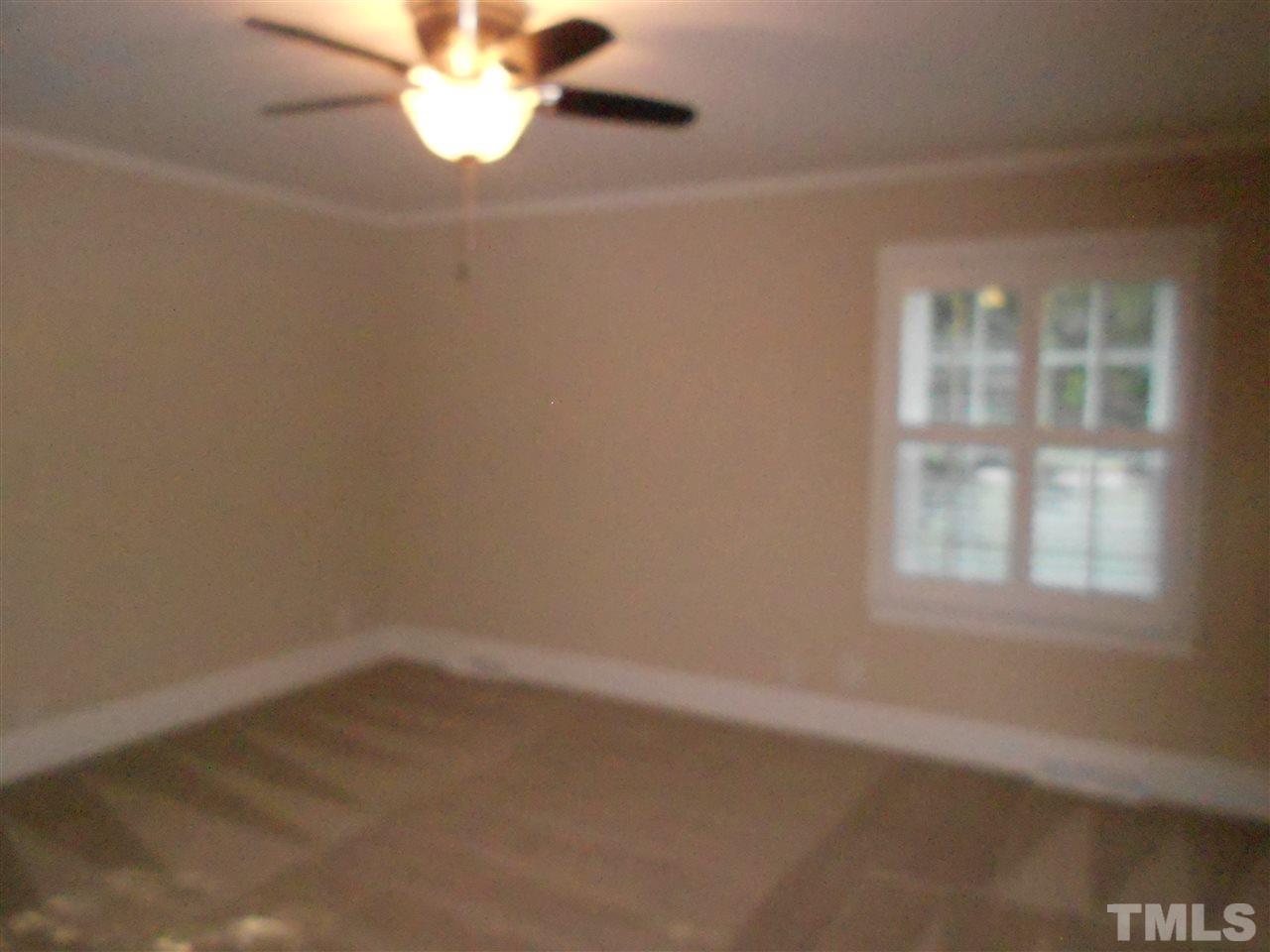 1208 Bancroft Street Raleigh, NC 27612 - Photo 5 of 22 an empty room with a window