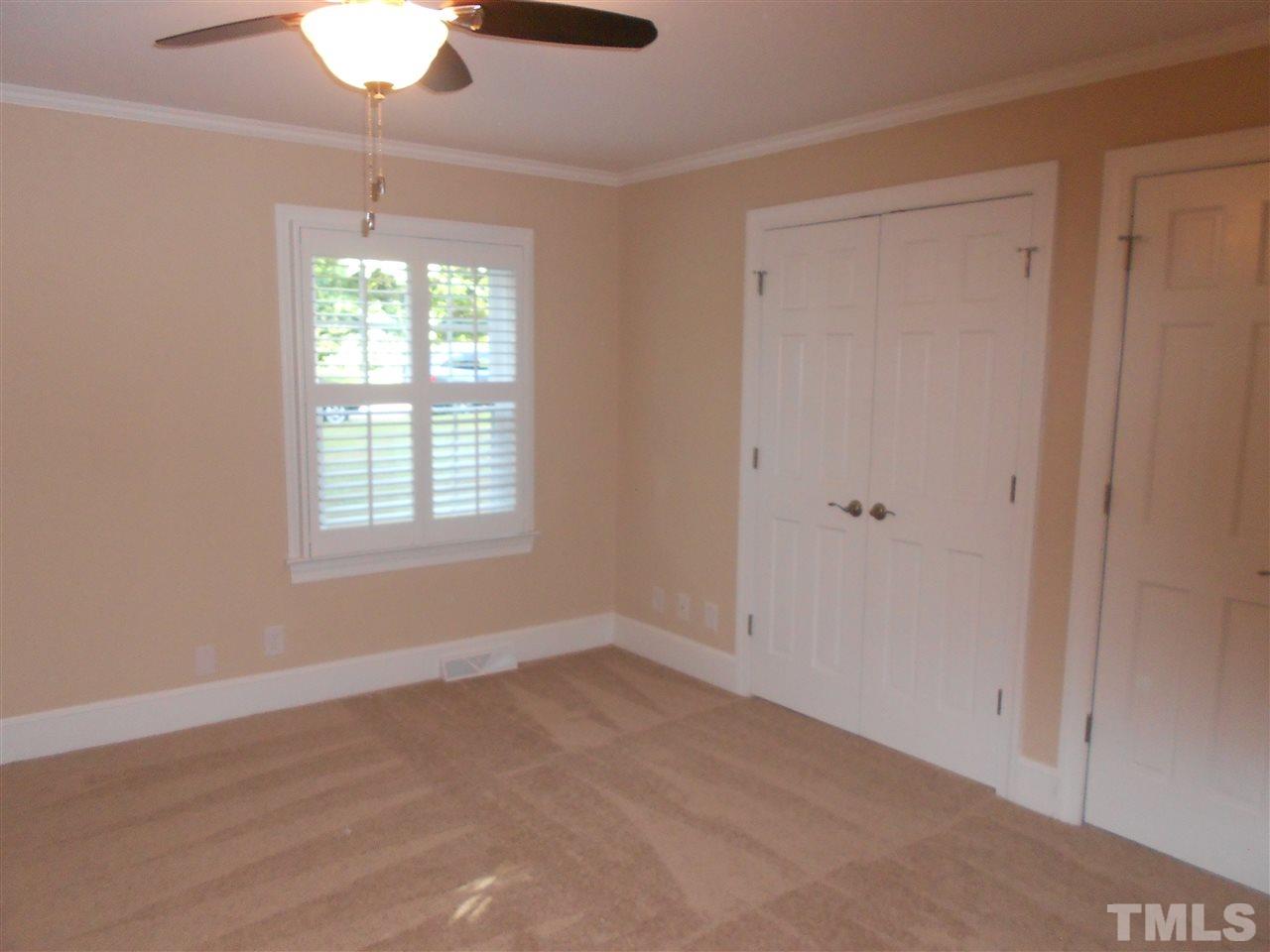 1208 Bancroft Street Raleigh, NC 27612 - Photo 7 of 22 a view of an empty room with a window