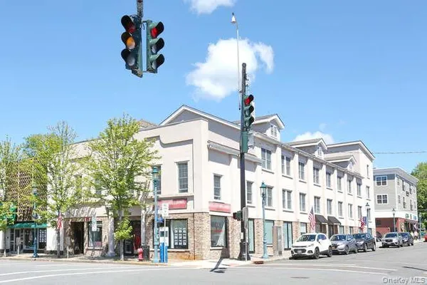 a front view of a building with street view