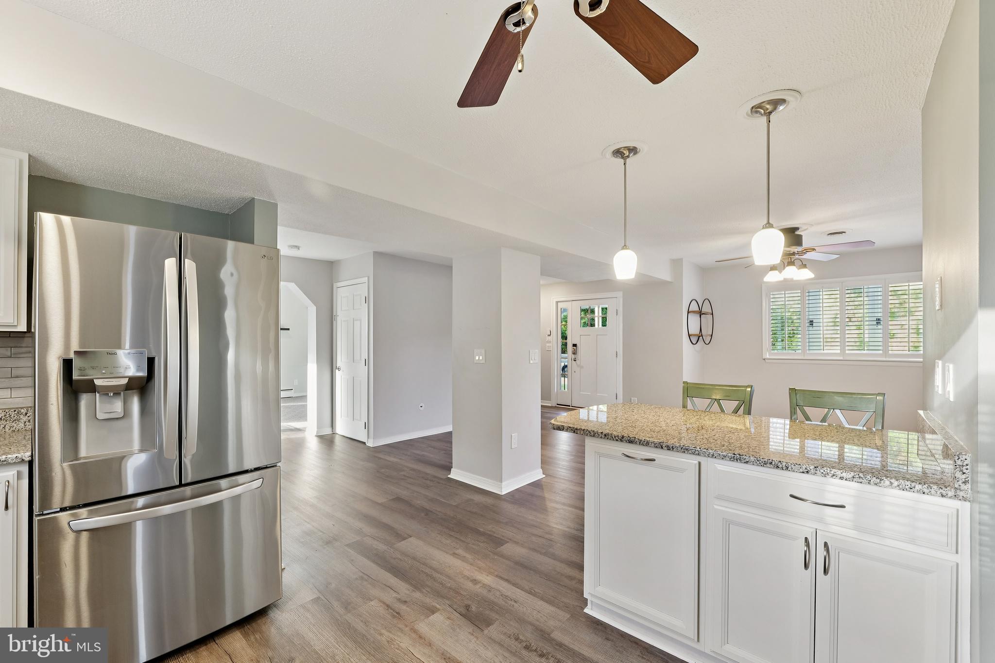 2105 Silver Lane Road Baltimore, MD 21221 - Photo 19 of 55 a kitchen with stainless steel appliances granite countertop a refrigerator a sink and a granite counter tops