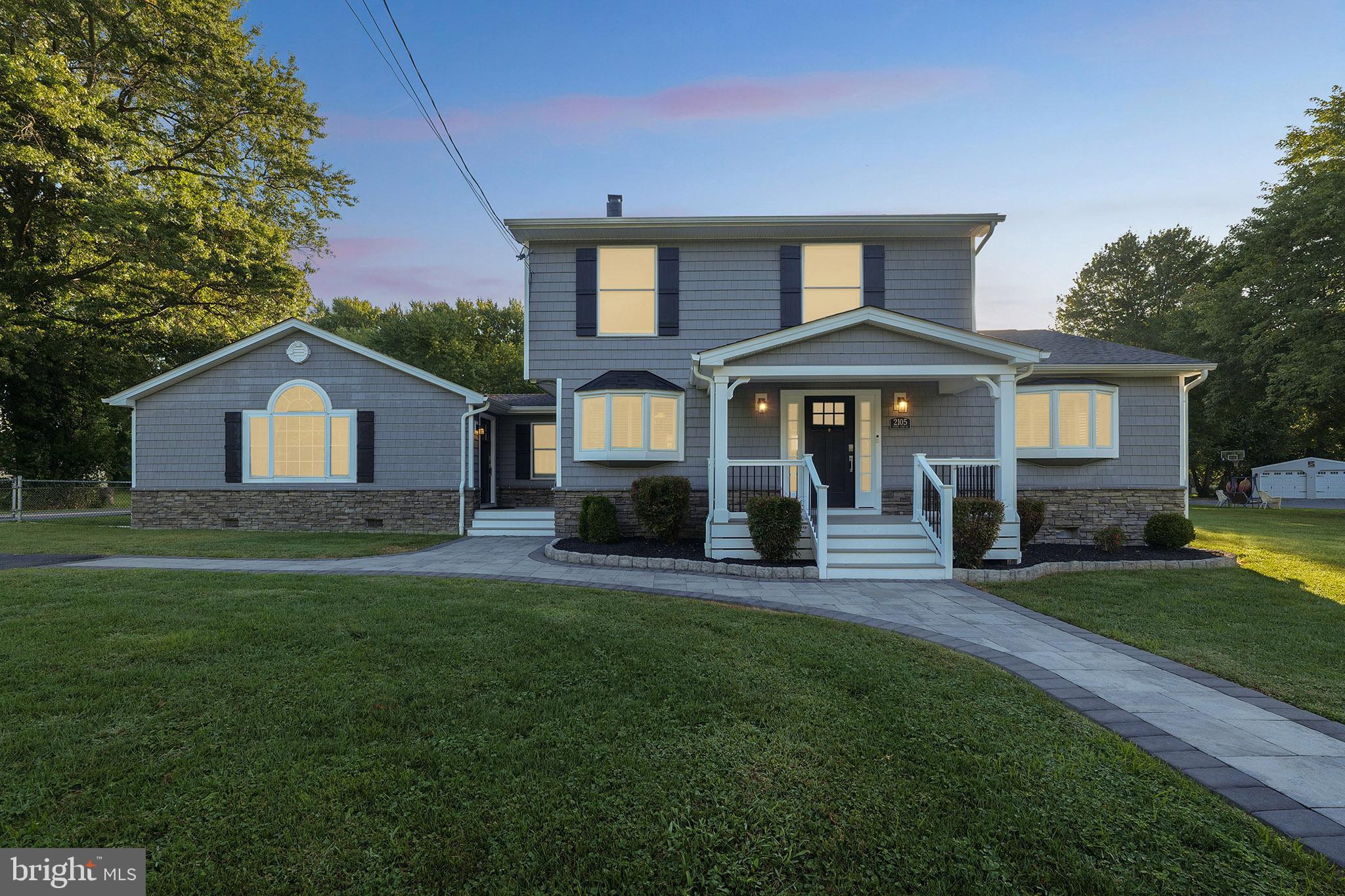 2105 Silver Lane Road Baltimore, MD 21221 - Photo 2 of 55 a front view of a house with a yard and porch