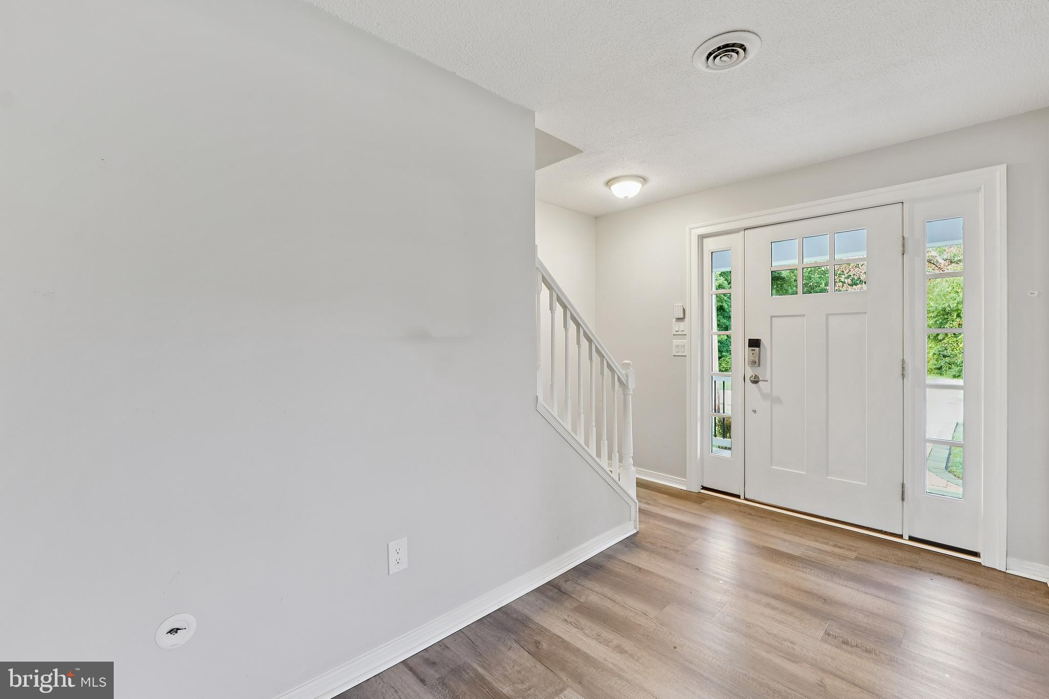 2105 Silver Lane Road Baltimore, MD 21221 - Photo 24 of 55 a view of a hallway with wooden floor and closet