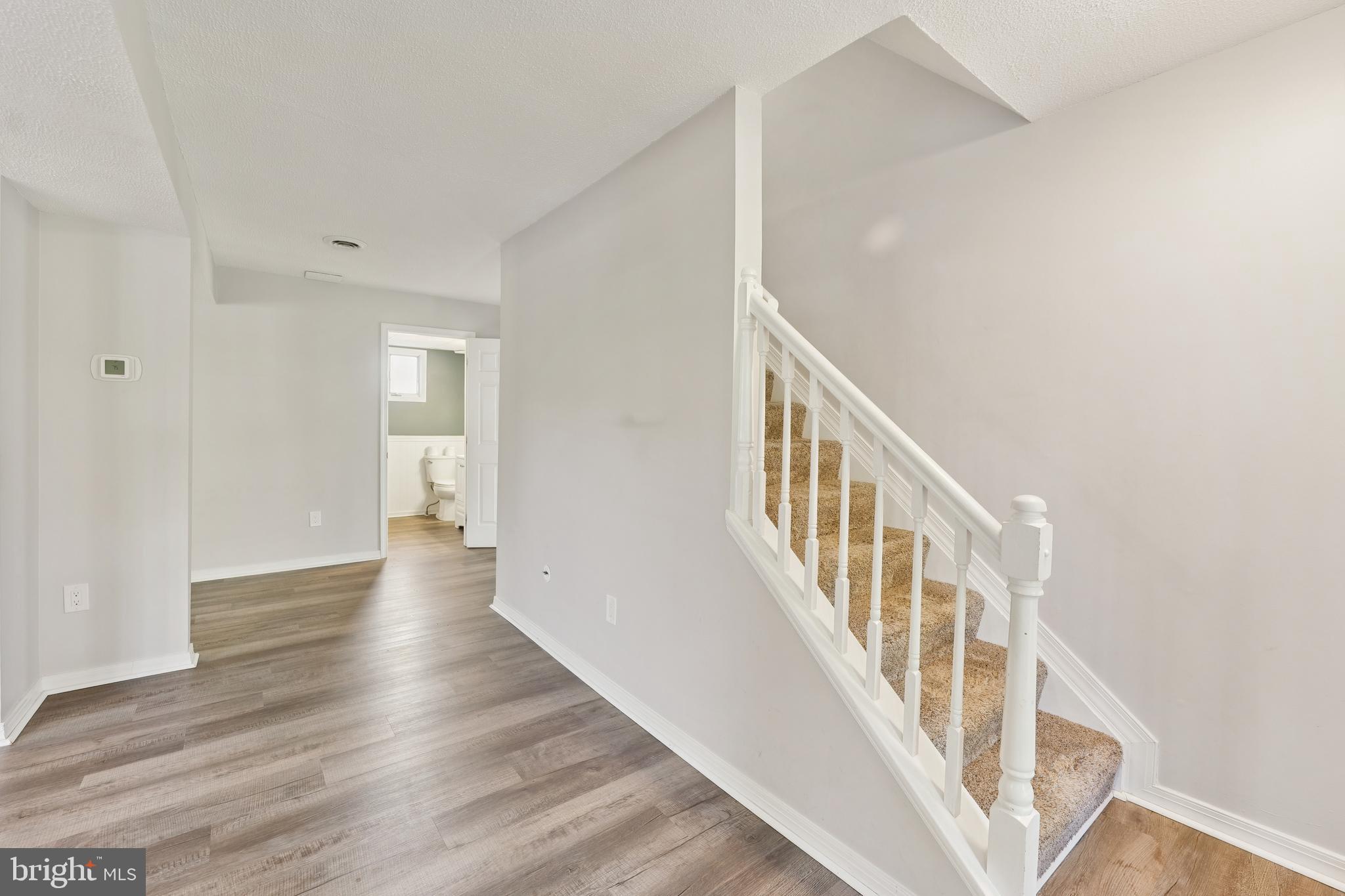 2105 Silver Lane Road Baltimore, MD 21221 - Photo 26 of 55 a view of an entryway with wooden floor