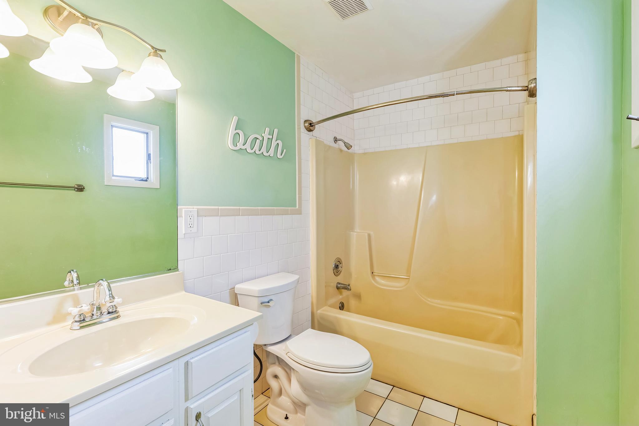 2105 Silver Lane Road Baltimore, MD 21221 - Photo 40 of 55 a bathroom with a sink toilet and shower