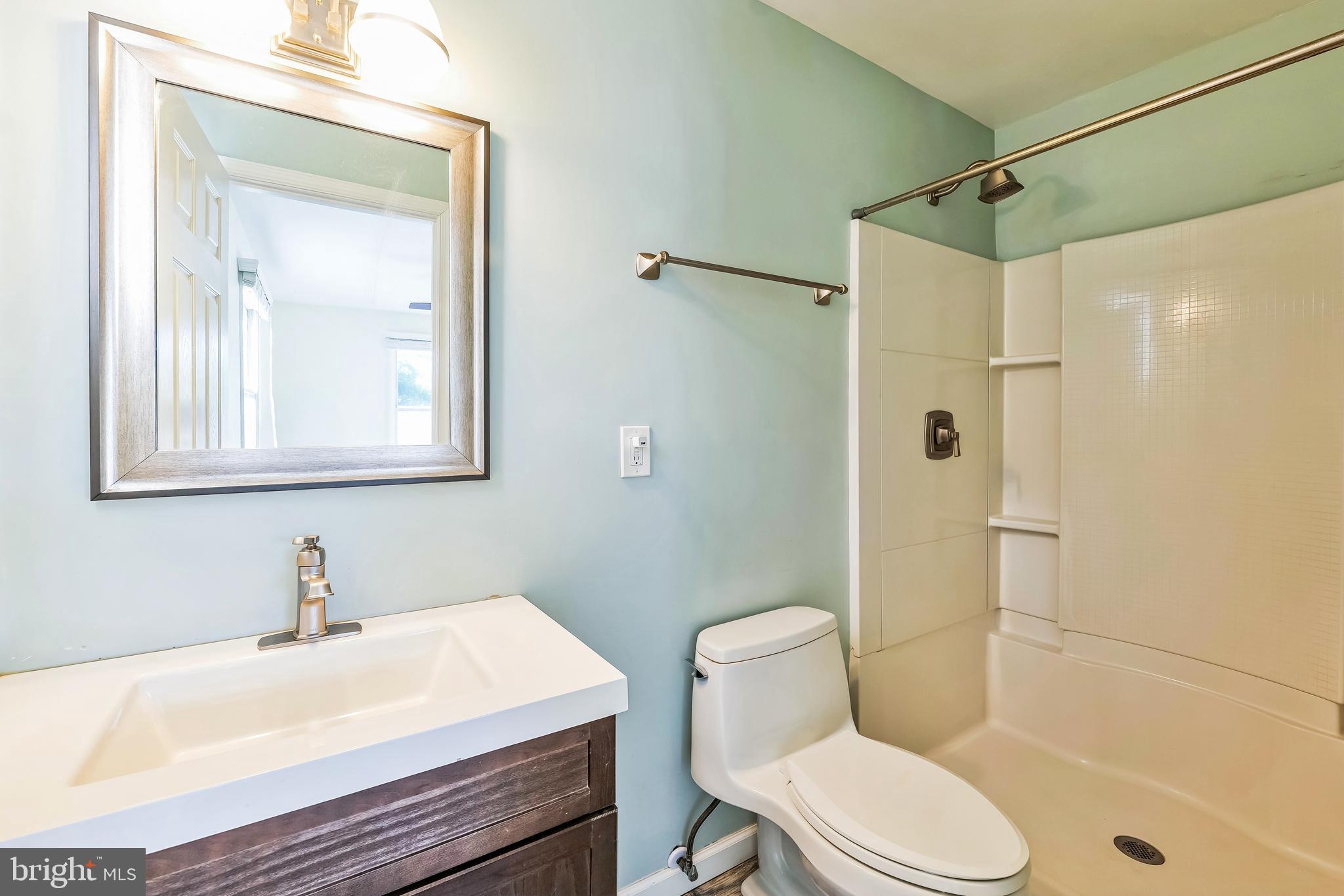 2105 Silver Lane Road Baltimore, MD 21221 - Photo 41 of 55 a bathroom with a sink toilet and shower