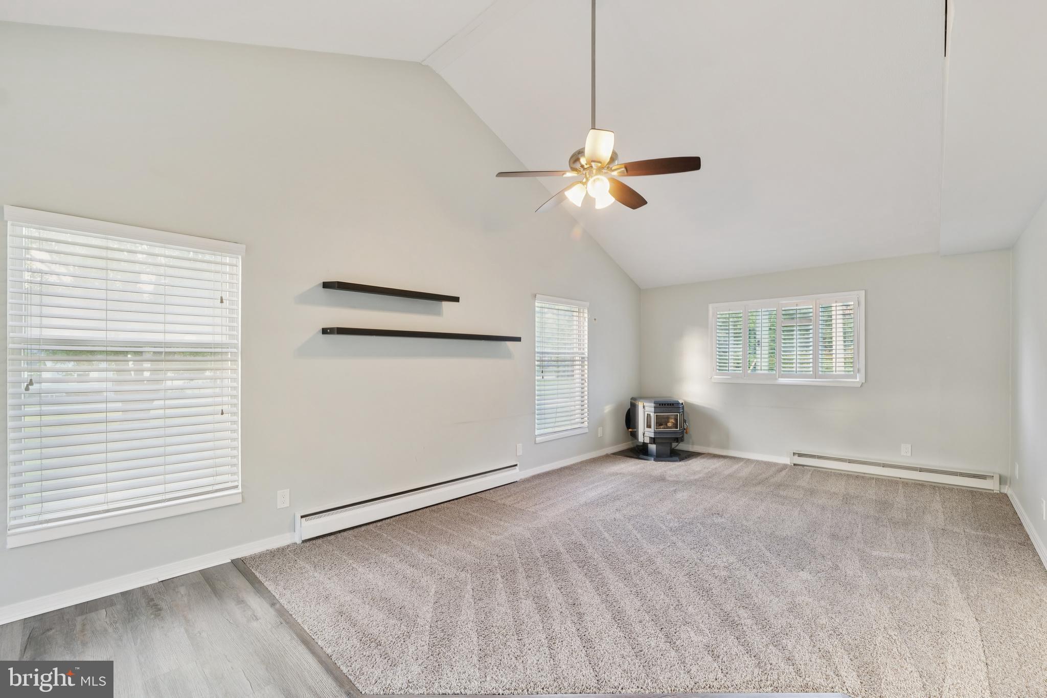 2105 Silver Lane Road Baltimore, MD 21221 - Photo 42 of 55 a view of a room with chandelier fan and windows