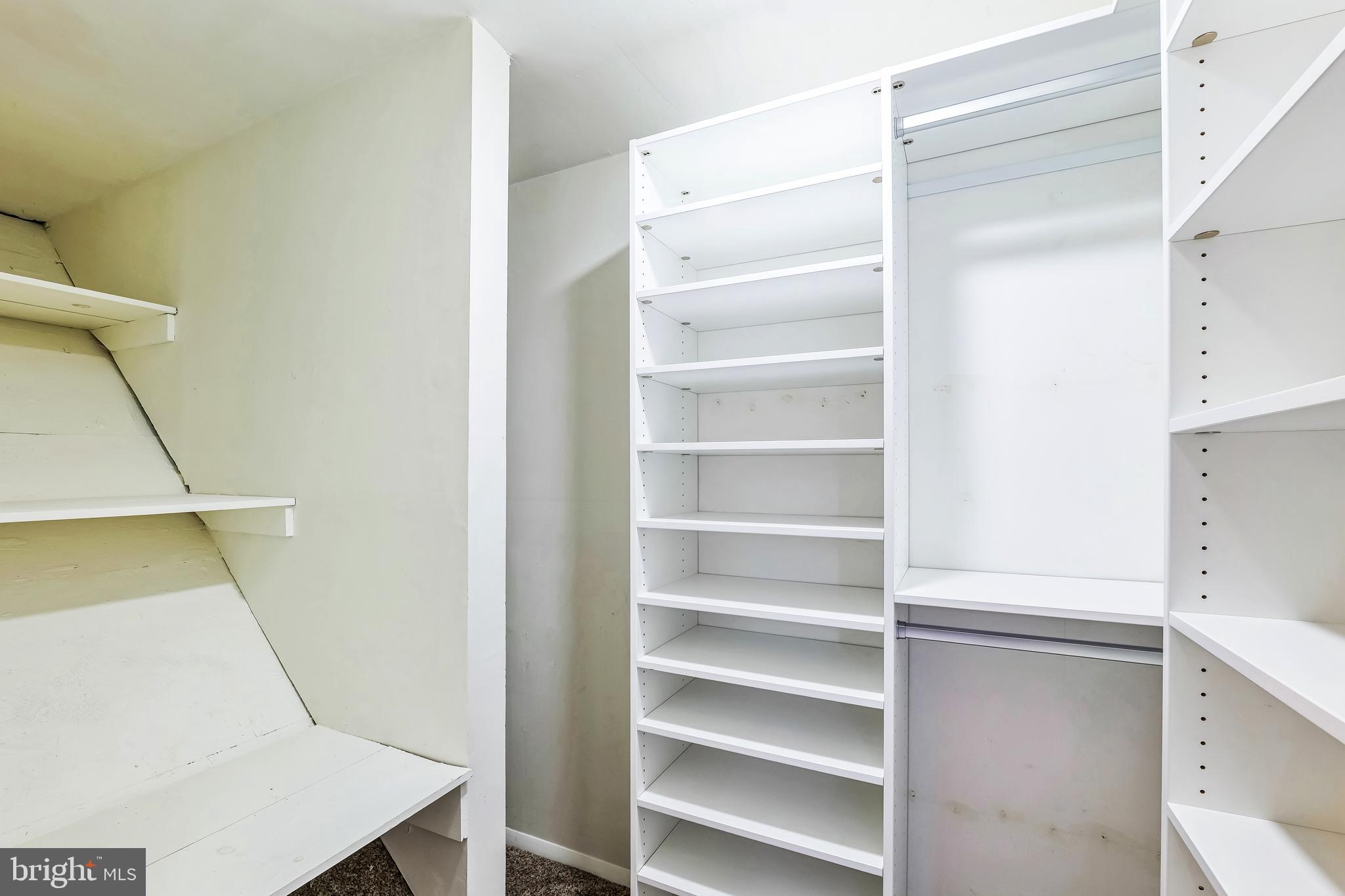2105 Silver Lane Road Baltimore, MD 21221 - Photo 50 of 55 a view of walk in closet with empty racks