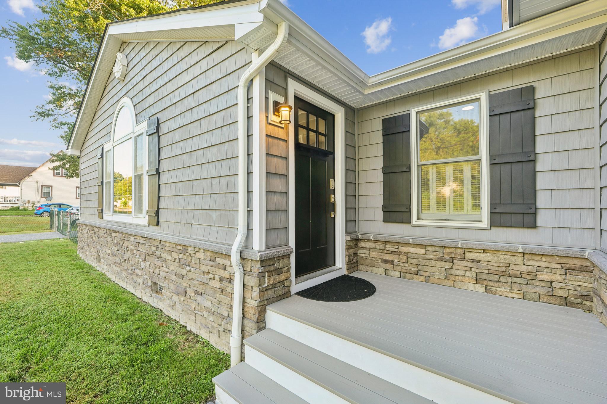 2105 Silver Lane Road Baltimore, MD 21221 - Photo 6 of 55 a front view of a house with a garden