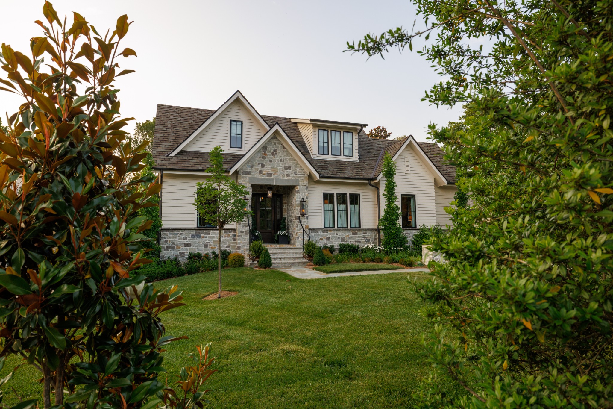 280 Harding Place Nashville, TN 37205 - Photo 2 of 79 a front view of a house with a yard and sitting area