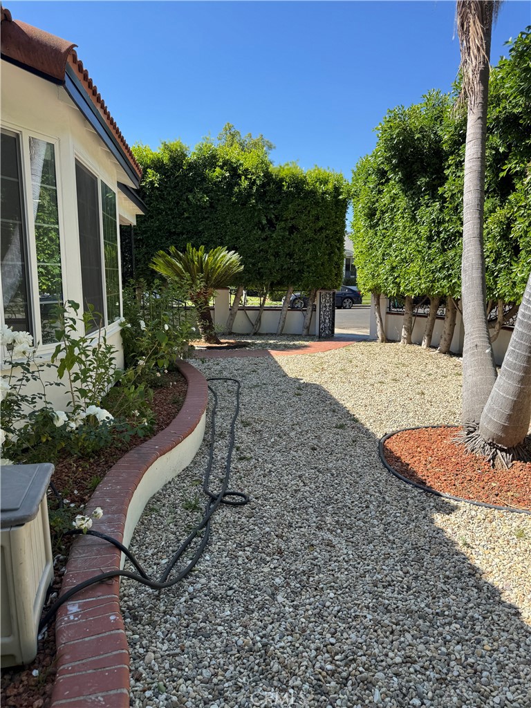 5230 Seville Avenue Encino, CA 91316 - Photo 14 of 61 a view of a backyard with plants and patio