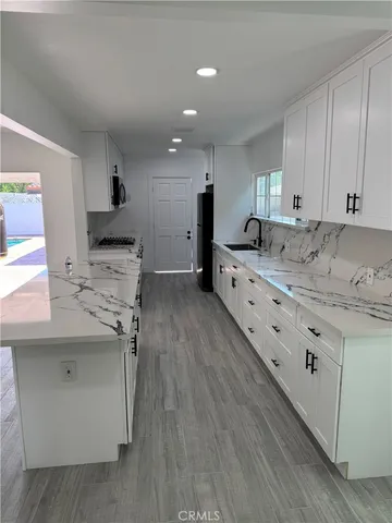 a view of a swimming pool with a yard