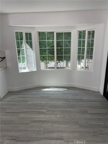 a view of a house with pool and sitting area