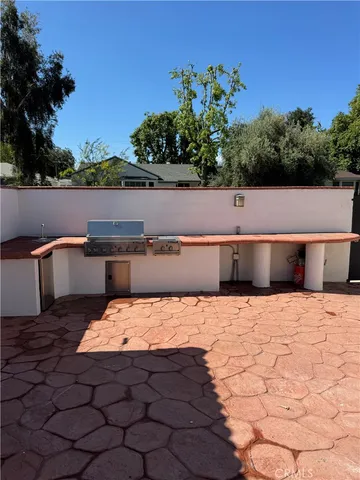 a room with a sink and cabinets