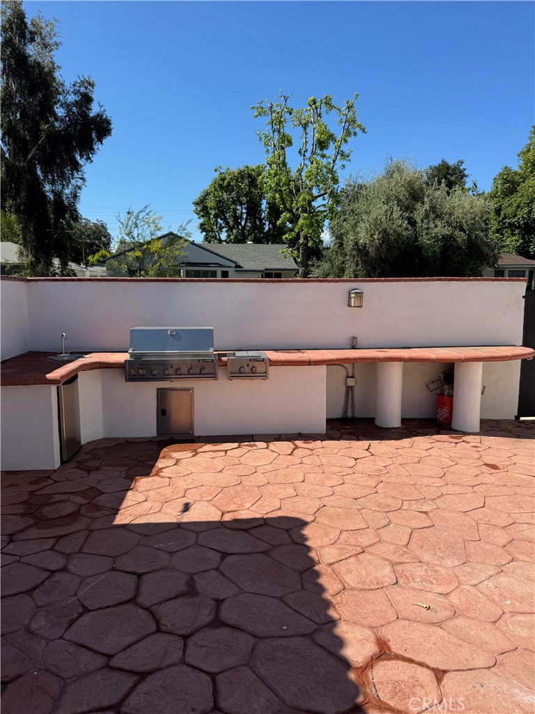 5230 Seville Avenue Encino, CA 91316 - Photo 28 of 61 a view of a terrace with a lake view