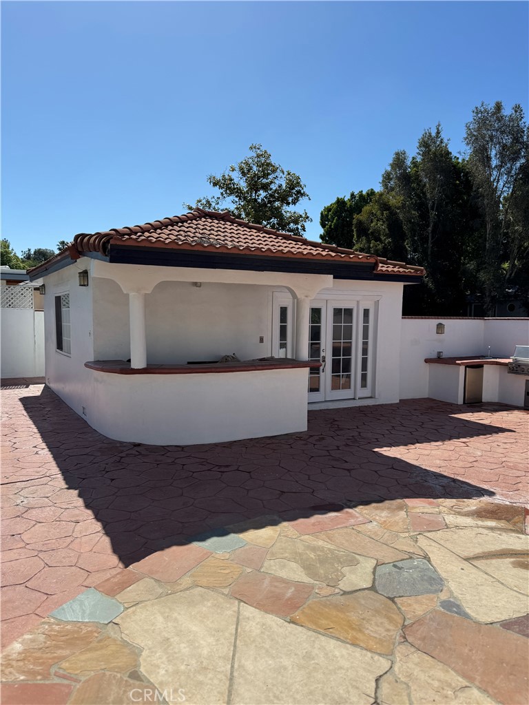 5230 Seville Avenue Encino, CA 91316 - Photo 29 of 61 a front view of a house with a yard