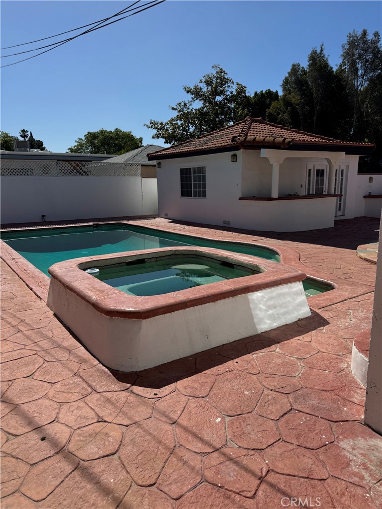 5230 Seville Avenue Encino, CA 91316 - Photo 30 of 61 a view of swimming pool with a yard and seating area