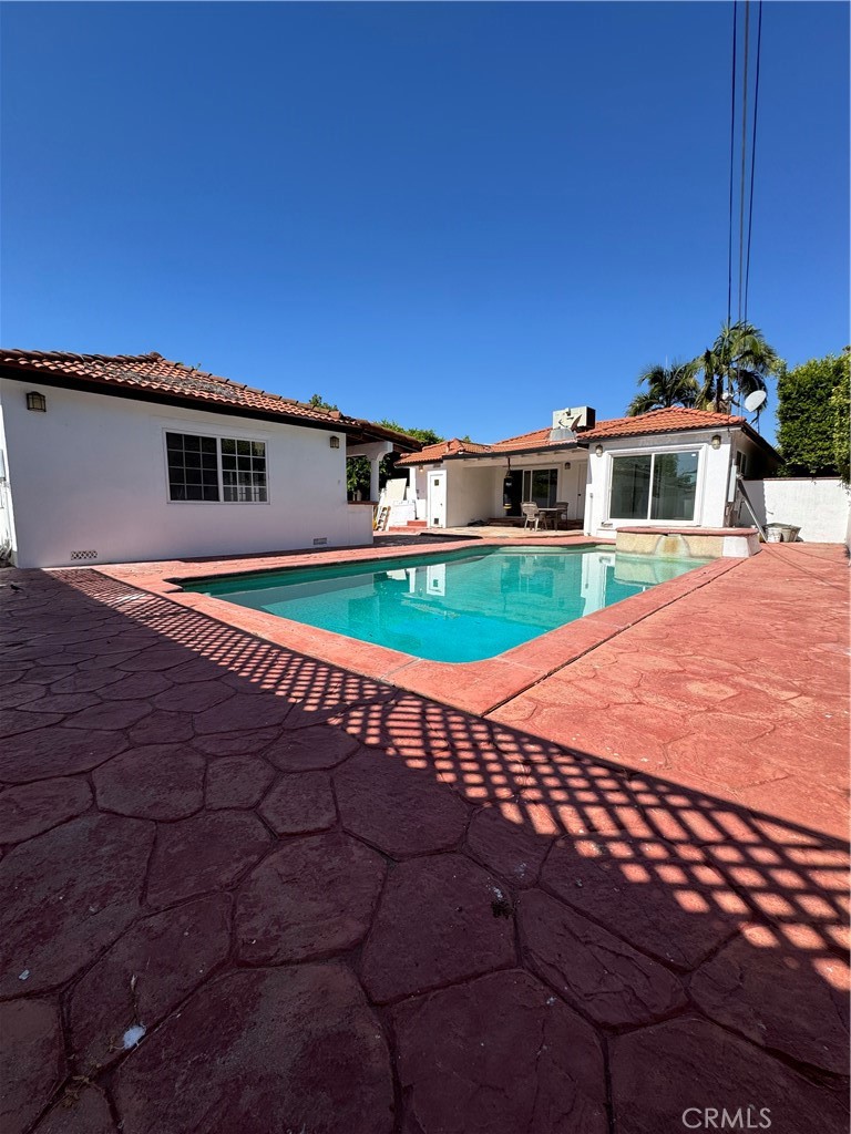 5230 Seville Avenue Encino, CA 91316 - Photo 33 of 61 a front view of a house with a yard