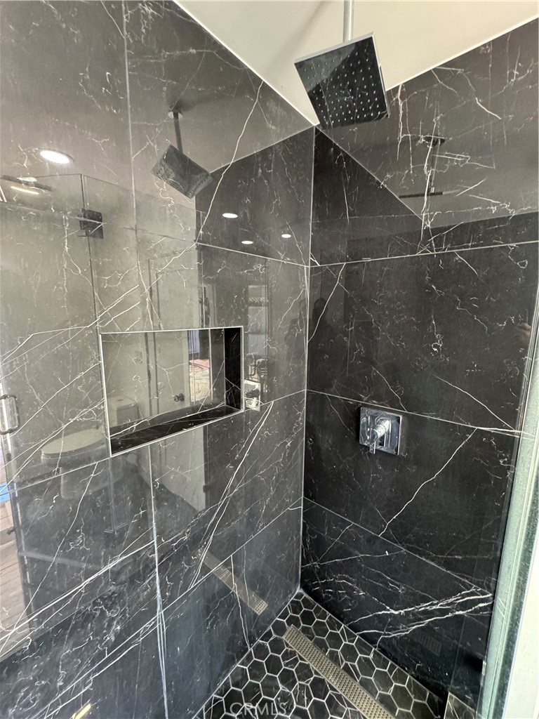 5230 Seville Avenue Encino, CA 91316 - Photo 38 of 61 a bathroom with a shower