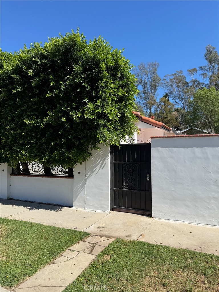 5230 Seville Avenue Encino, CA 91316 - Photo 4 of 61 front view of a house with a yard