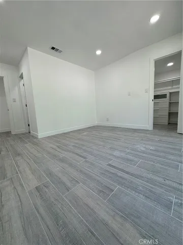 a large kitchen with a large stove a sink and cabinets