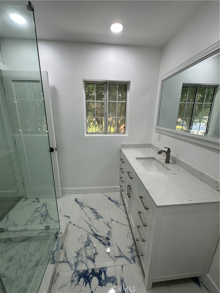 5230 Seville Avenue Encino, CA 91316 - Photo 53 of 61 a bathroom with a sink toilet and shower