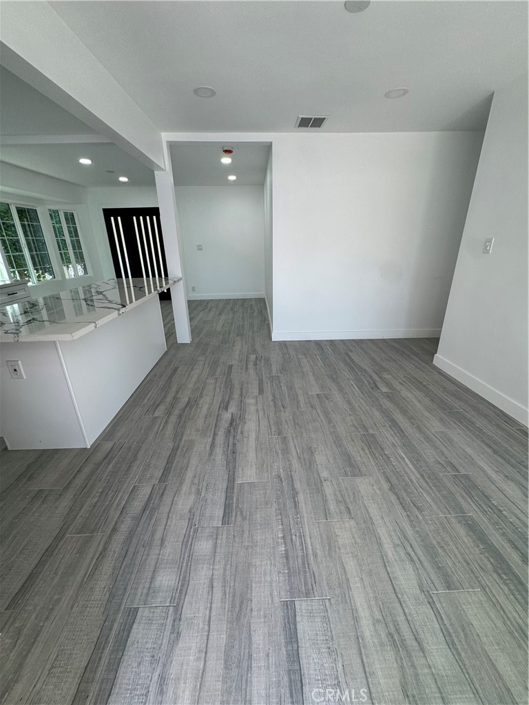 5230 Seville Avenue Encino, CA 91316 - Photo 54 of 61 wooden floor in an empty room with a window