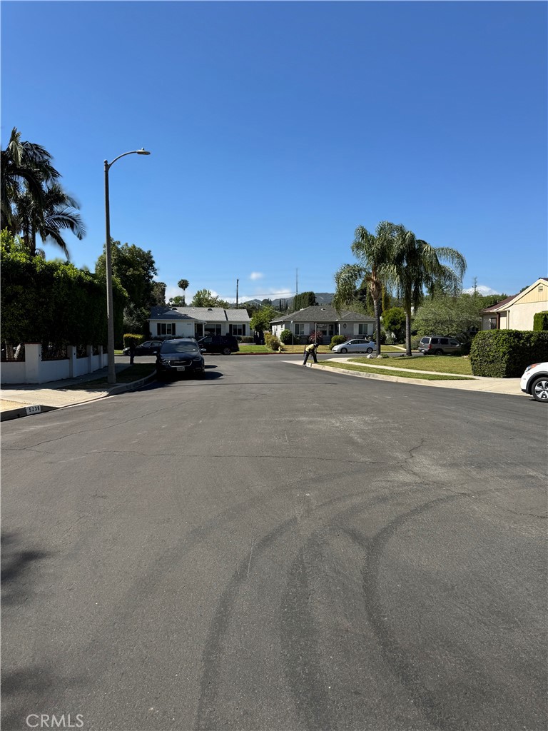 5230 Seville Avenue Encino, CA 91316 - Photo 9 of 61 a view of a road with a building in the background