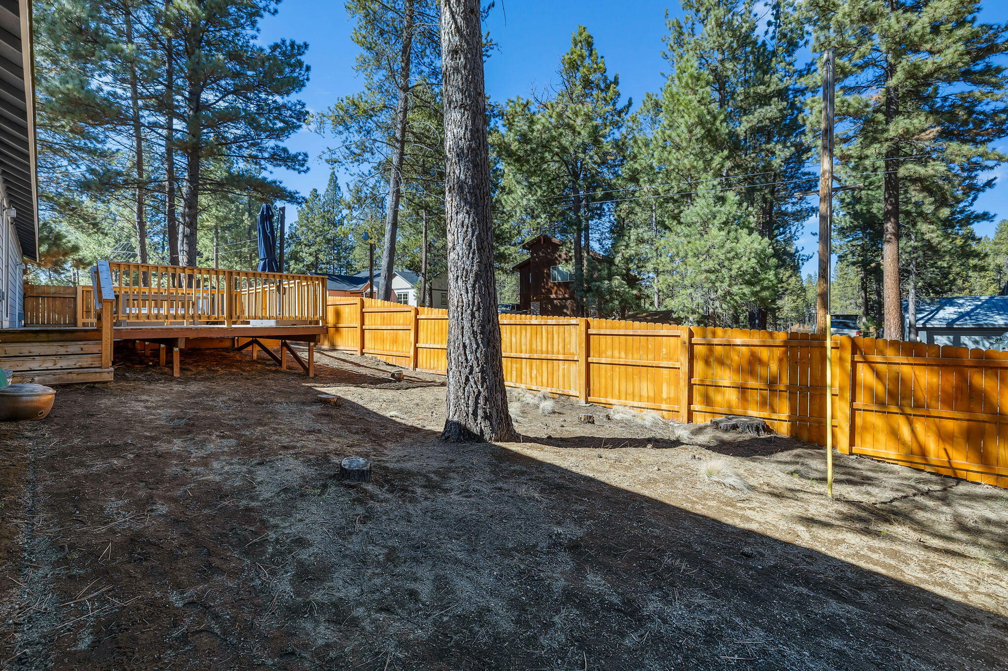17064 Sacramento Road Bend, OR 97707 - Photo 35 of 50 a view of a yard with wooden fence