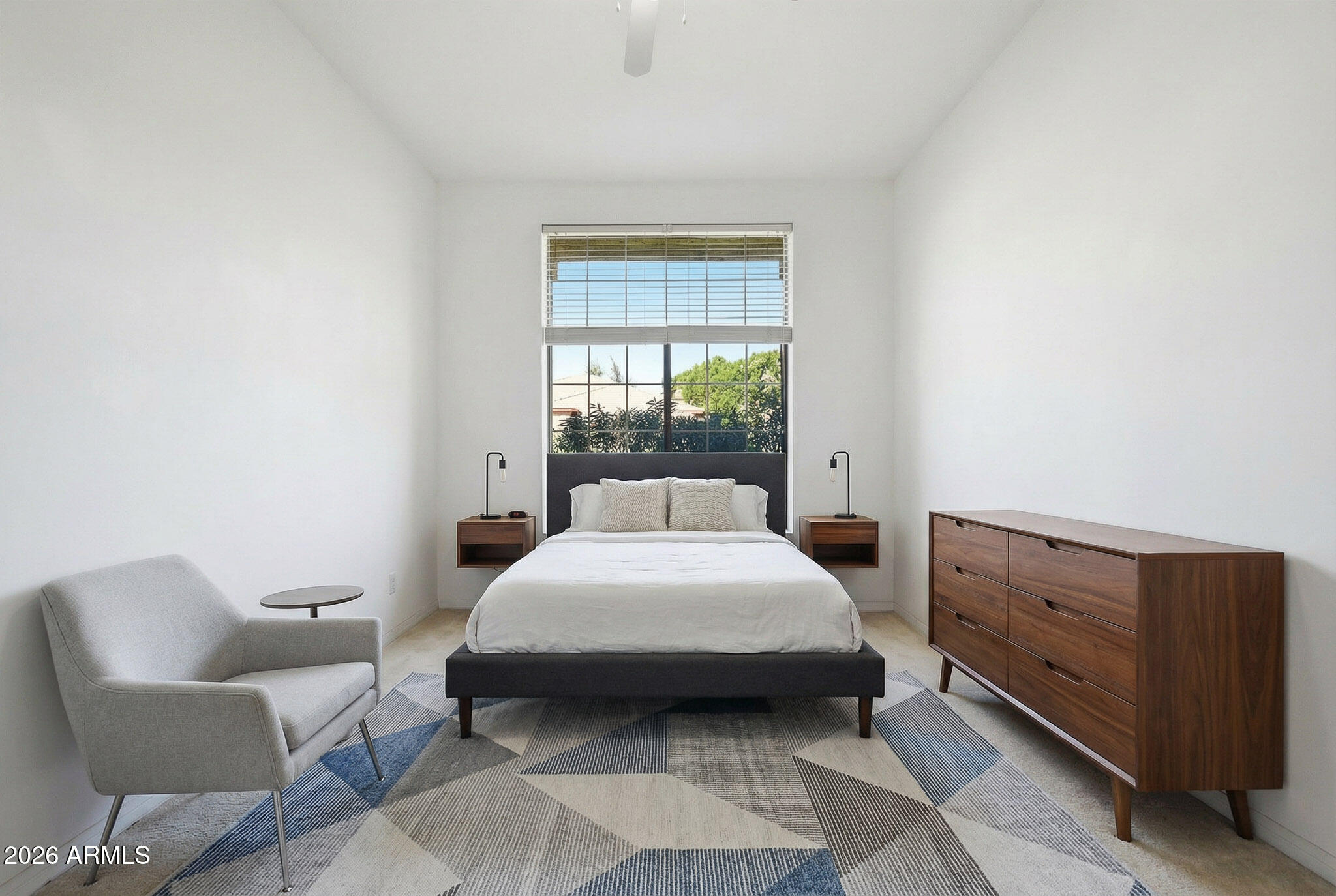 4149 North 49th Way Phoenix, AZ 85018 - Photo 14 of 25 a bedroom with a bed and window