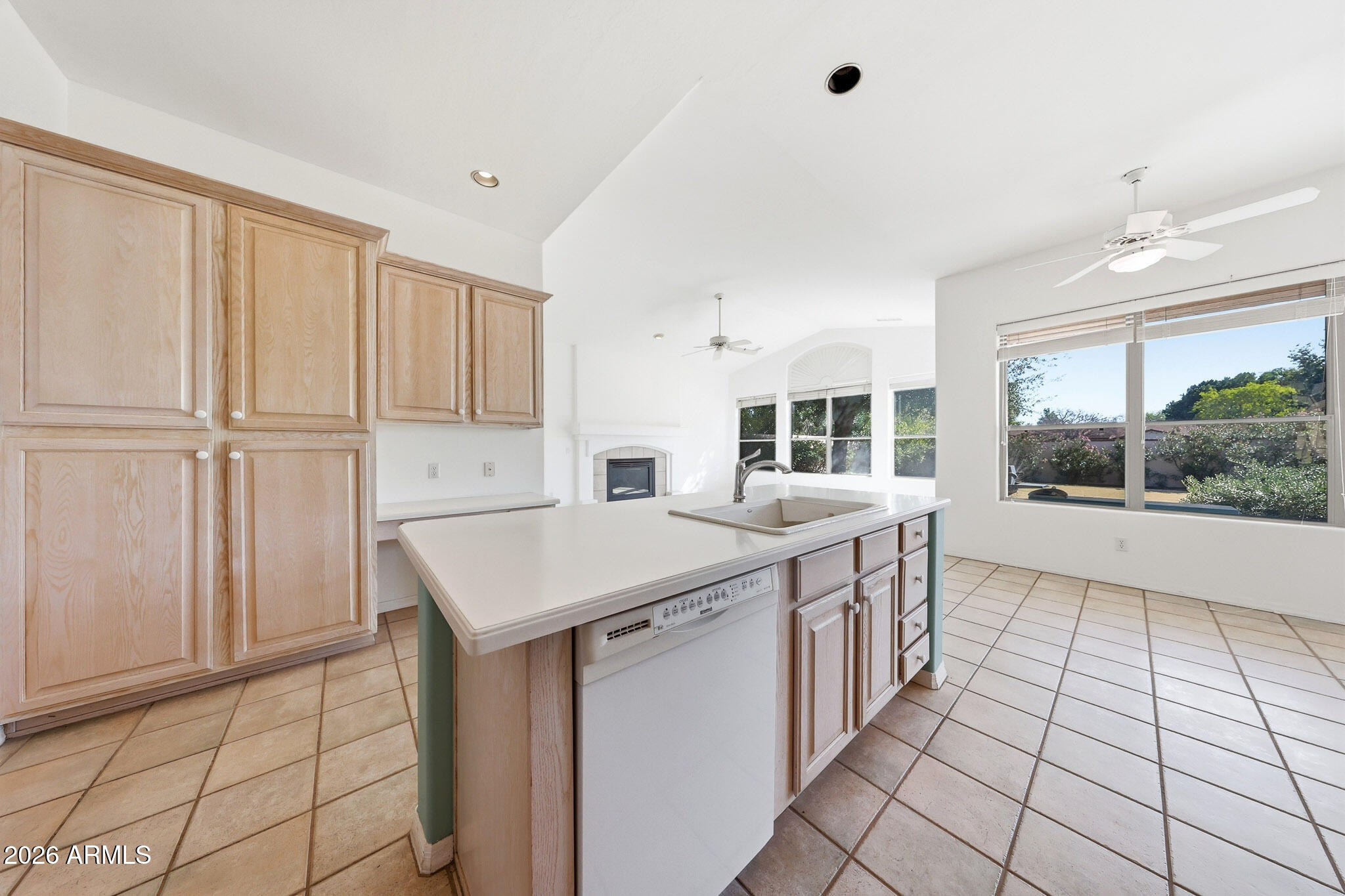 4149 North 49th Way Phoenix, AZ 85018 - Photo 16 of 25 a kitchen with a sink stove and cabinets